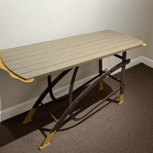 Gene-Shaw-Yellow-Legged-Table-wood-and-metal-table